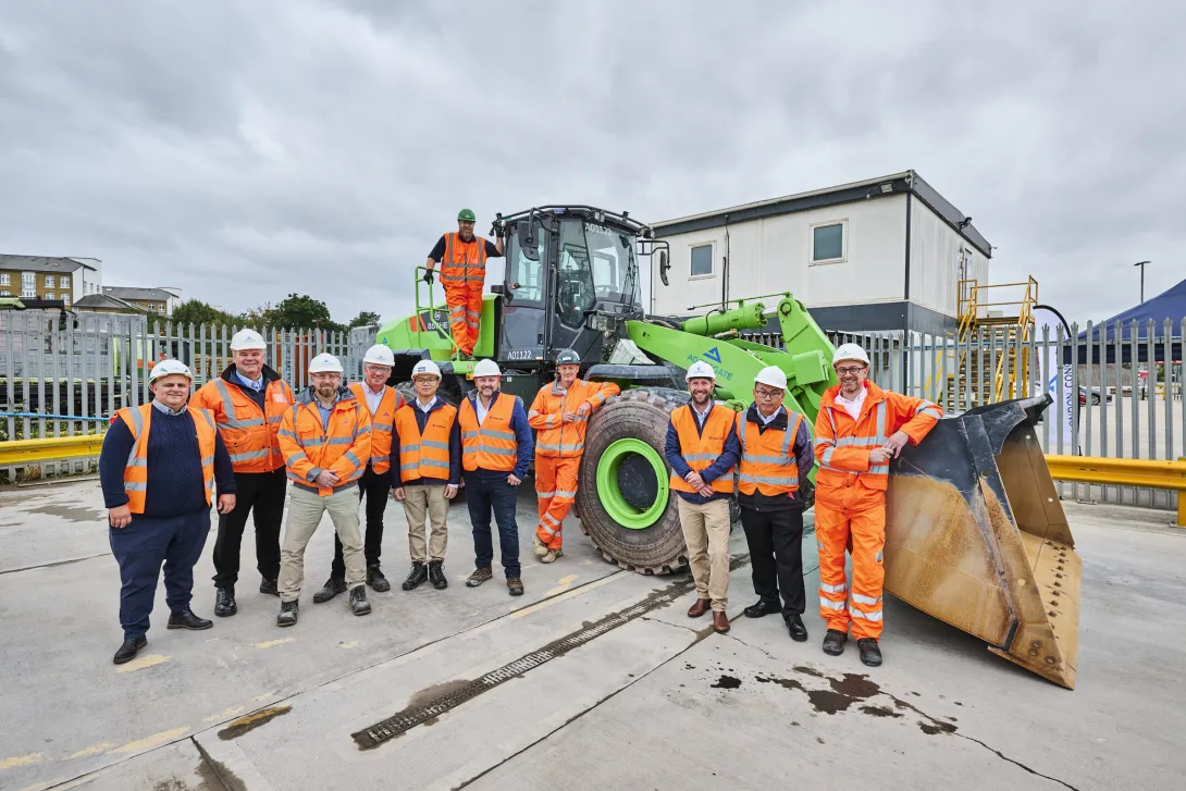 Representatives from Aggregate Industries and manufacturer Liugong with the new electric wheel loading shovel at Bow.