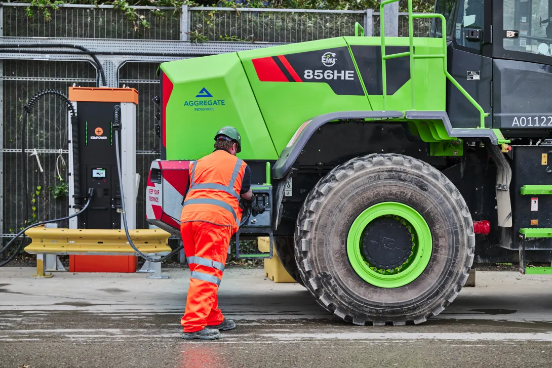 An Aggregative Industries colleague plugs the electric loading shovel into on site EV charging point at Bow.