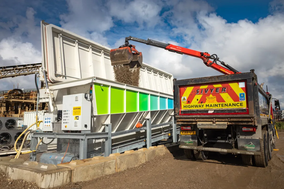 A sivyer lorry offloads demolished aggreates into the neustark machine at Greenwich