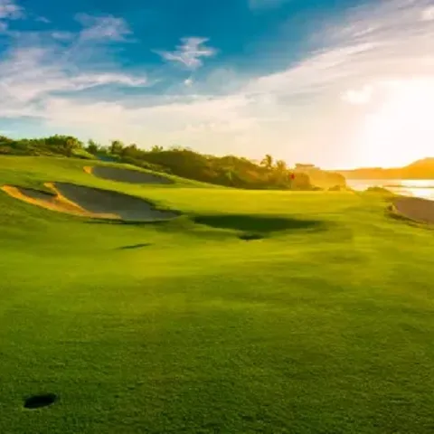 Golfing range green hill and sky